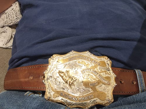 Customer wearing the brown 1.75" Xtreme belt with a large, decorative custom buckle.