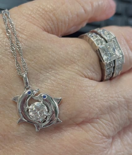 Customer photo review of Double Dolphin Surround Moissanite Necklace In Sterling Silver