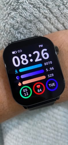 Customer's Gard Pro Health 4 Smartwatch on their wrist, showing the colorful, data-rich watch face.