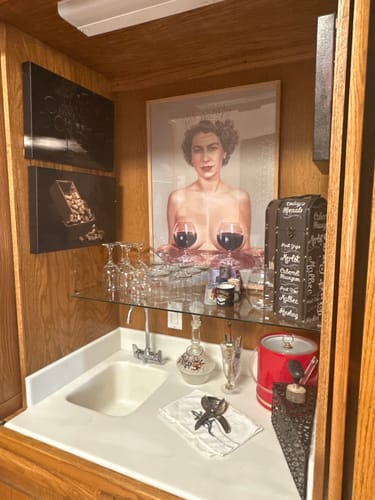 Customer's Dark Oak Gallery Frame with a large art print displayed in their home wine bar.