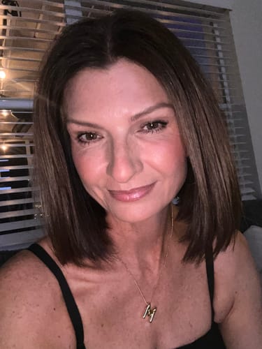 A selfie of the reviewer showing her smooth skin after using the Seranova Micro Infusion System.
