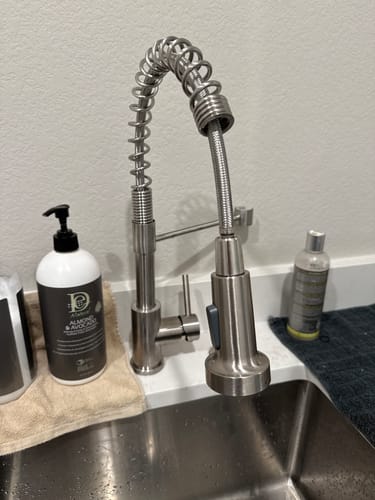 Customer's Spiro Single-Hole Kitchen Faucet with a spring spout installed in a laundry room sink.
