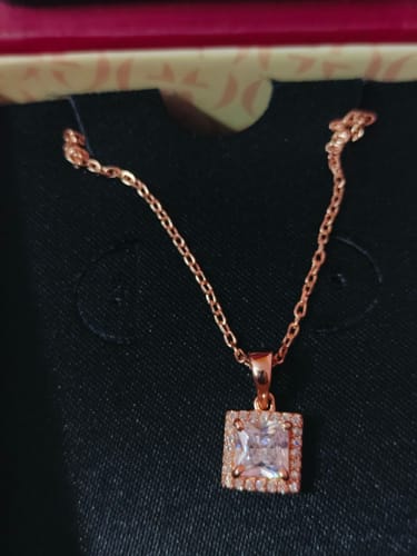 Customer's Rose Gold Snow White Pendant with a square stone, displayed in its elegant black gift box.