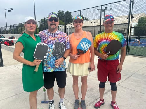 Reviewer with other players at a pickleball tournament, wearing CUURT Muuv Wide Toe Box Court Shoes.