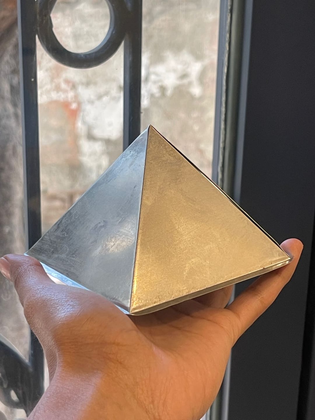 Customer photo review of Tri-Dhatu Hollow Vastu Pyramid – Alloy Metal Vastu Remedy for Protection & Prosperity | Ideal for Home, Office & Spiritual Areas | 4 cm | 120 g