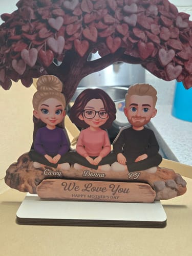 Customer's personalized 2-layered wooden plaque showing a mom with a daughter and son under a large heart tree.