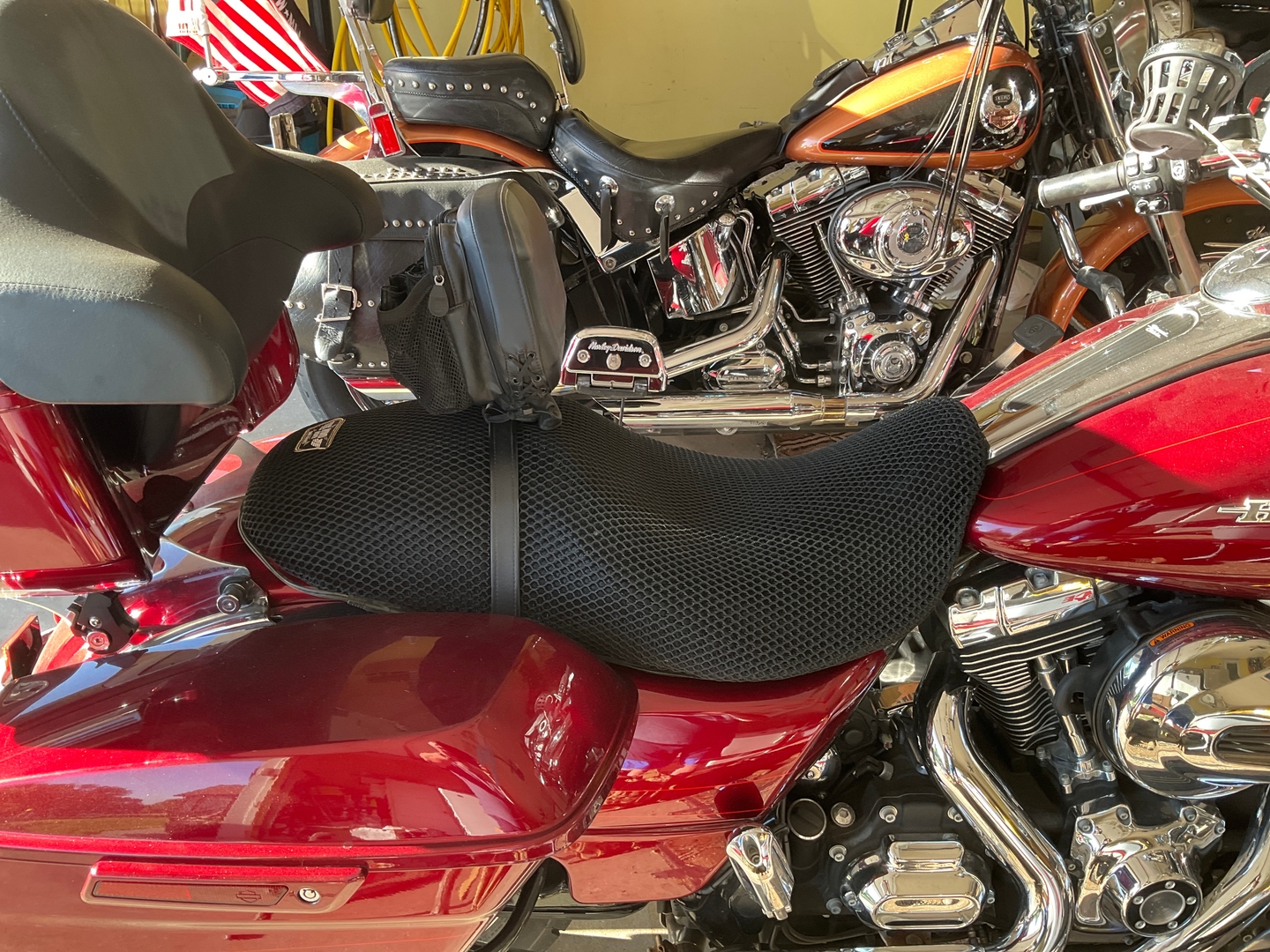 Close-up of Road Glide factory vinyl seat surface showing heat and wear after long miles on the road