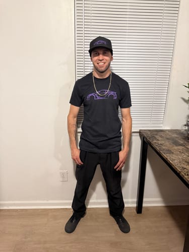 Customer wearing the black 80Eighty® DCG88 Shirt with a purple car graphic.