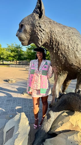Customer wearing the Suiting Floral Jacquard Blazer and matching skirt as a graduation outfit.