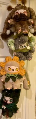 Customer shows four different Siinono Whispers of 'Ta' Series plush toys hanging together in a vertical line.