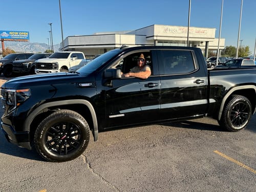 Customer's black GMC Sierra with a stock stance before installing the leveling lift kit.