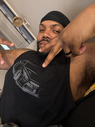 Customer wearing the black 80Eighty® Frontline Tank, showing the fit and car graphic.