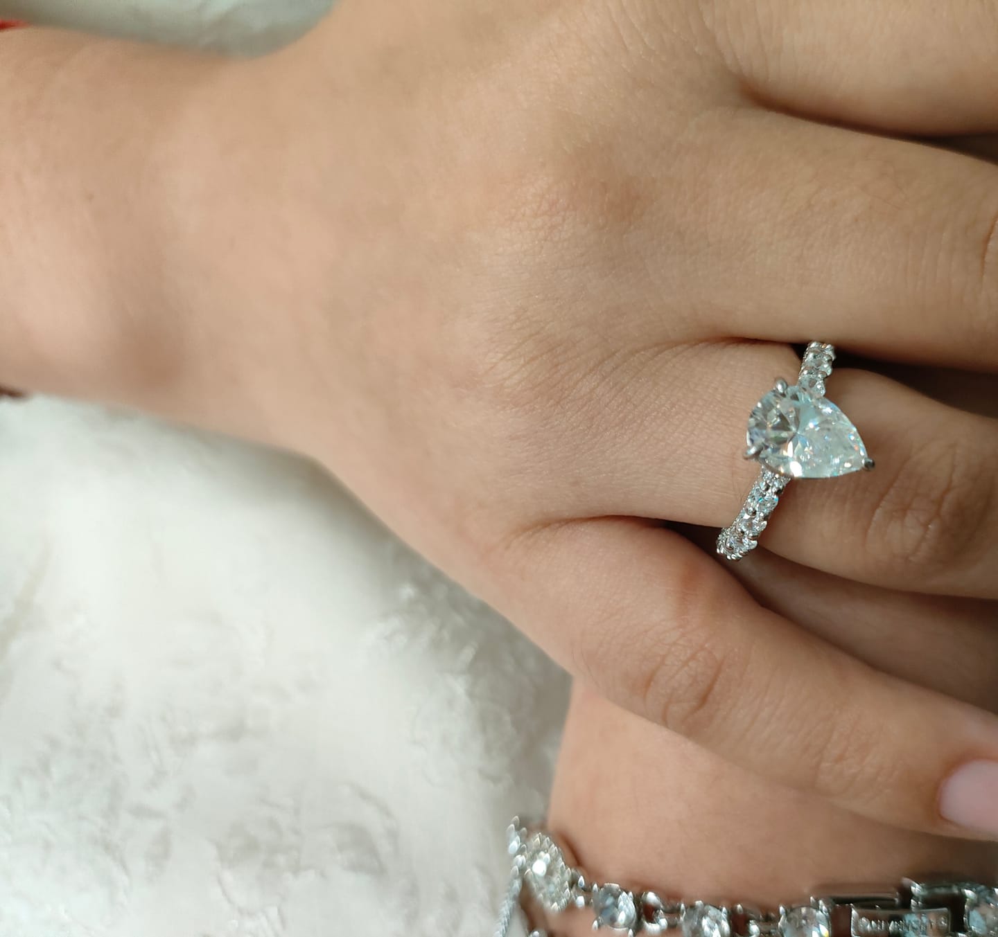 Customer photo review of S925 Moissanite 2.0 Carat Pear Cut 18K White Gold Pavé Band Solitaire Style Engagement Ring