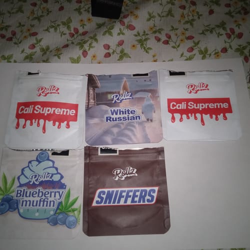 Customer's photo showing five different branded pouches for cannabis flower products.