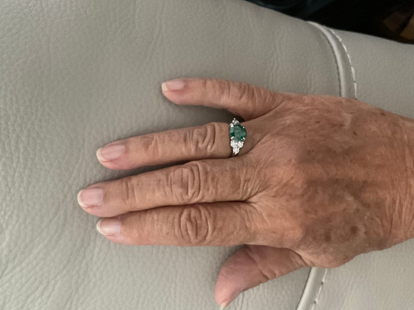 Customer photo review of Green Moissanite Side Stone Engagement Ring