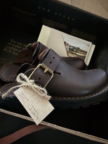 Customer's new Brown Karoo Clogs, made of dark leather, resting inside their original black box.