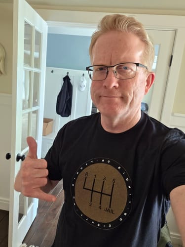 Reviewer wearing the black '6Speed = Jail' shirt, showing the fit and front graphic.