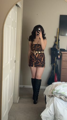 Customer takes a mirror selfie to show the fit of the Suiting Tortoise Mini Dress.