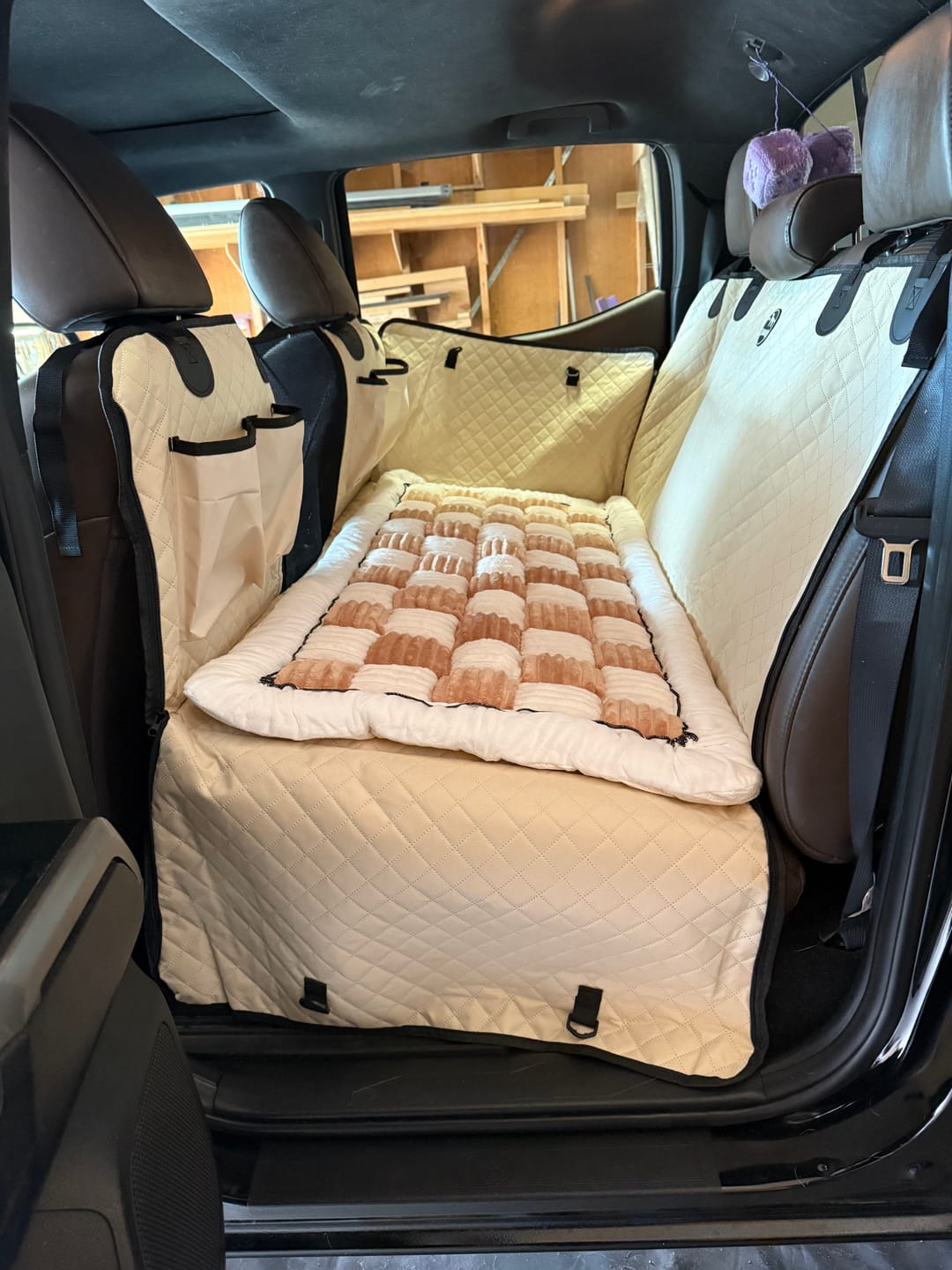 Customer photo review of NEW Waterproof Hard Bottom Car & Truck Seat Foldable Hammock Cover With Storage Pockets, Side Flaps, Headrest Straps, Seat Anchors, & Mesh Window (+FREE SAFETY BELT!)