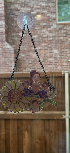 Customer's personalized sunflower suncatcher depicting a mom and three children hanging on a window.