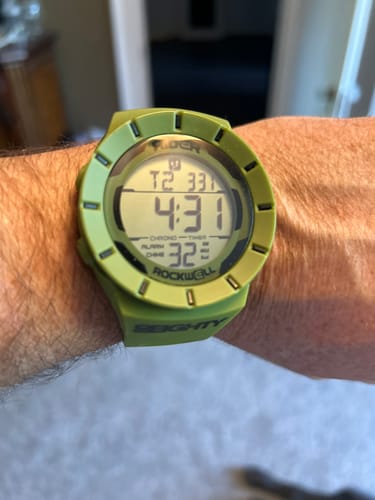 Customer showing the fit of the green Rockwell ArmyColiseum Watch on their wrist.