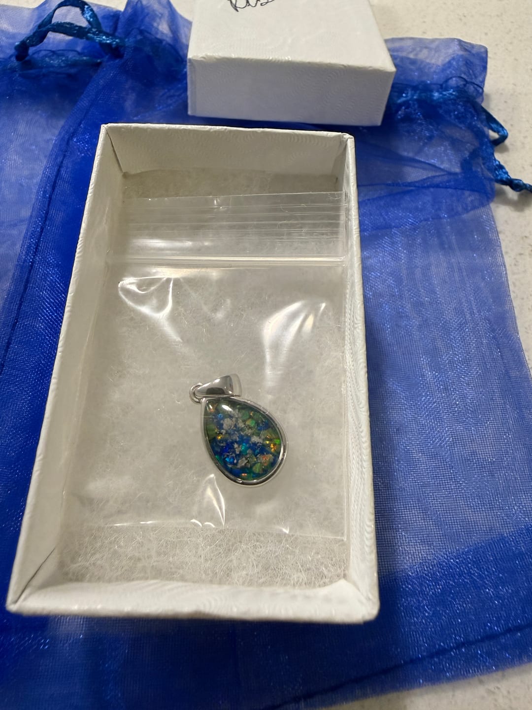 Customer photo review of Petite Pear Drop with Cremation Ashes