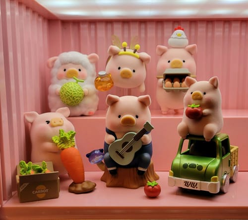 Customer's collection of Lulu The Piggy My Sweet Farm Garden figures displayed together on a pink tiered shelf.