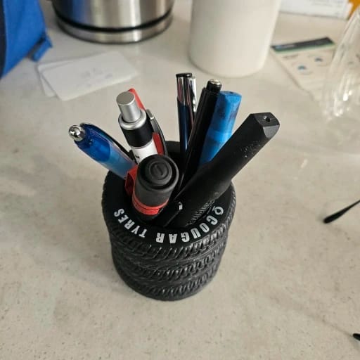 Customer photo review of 1pcs Fun Tire-Shaped Pen Holder -PVC Desk Organizer,