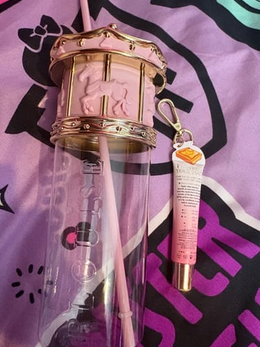 Customer's Sips & Soft Lips Mystery Bundle, showing the pink Merry Go Round cup and lip conditioner.