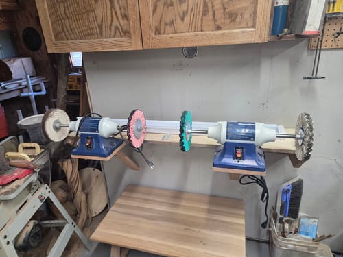 Customer's workshop with two buffer machines mounted, showing various colorful Airway Buffing Wheels attached.