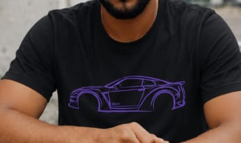 Reviewer's close-up of the black 80Eighty® DCG88 Shirt, highlighting the purple car graphic on the chest.