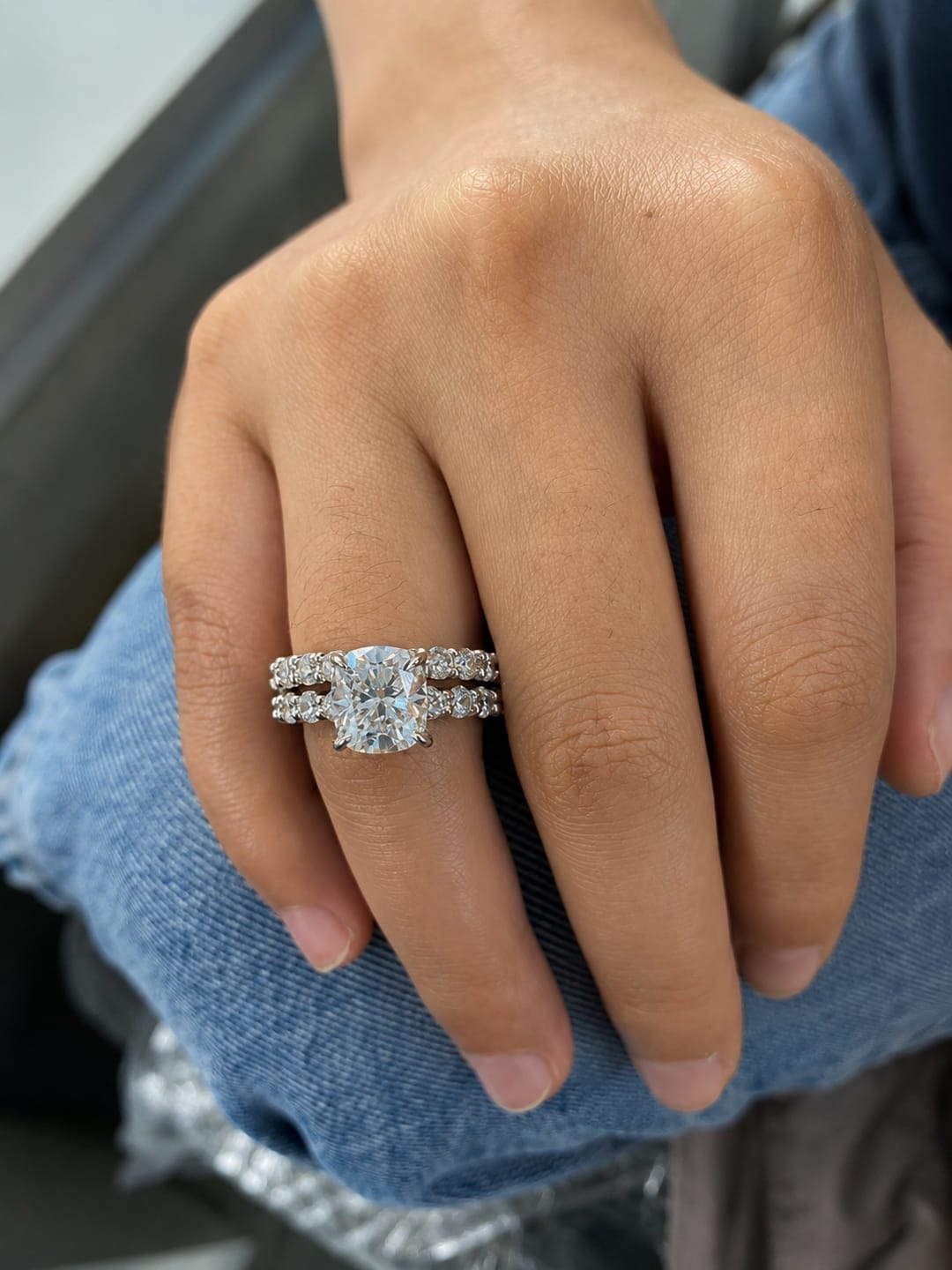 Customer photo review of Rodiffy Moissanite 3.0Ct Cushion Cut Side Stone White Gold Engagement Ring with Pavé Eternity Ring