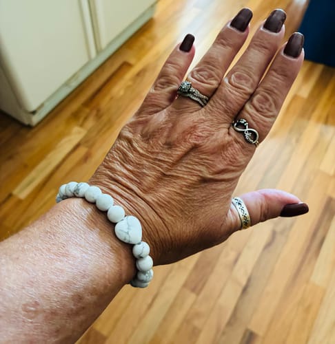 Customer wearing the white marbled crystal tester bracelet on their wrist.
