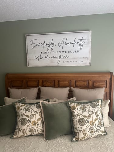 Customer's rectangular Faith Sign displayed on a green wall above a bed.