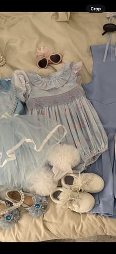 Customer's light blue Magical Princess Bubble laid flat with other clothes and accessories.