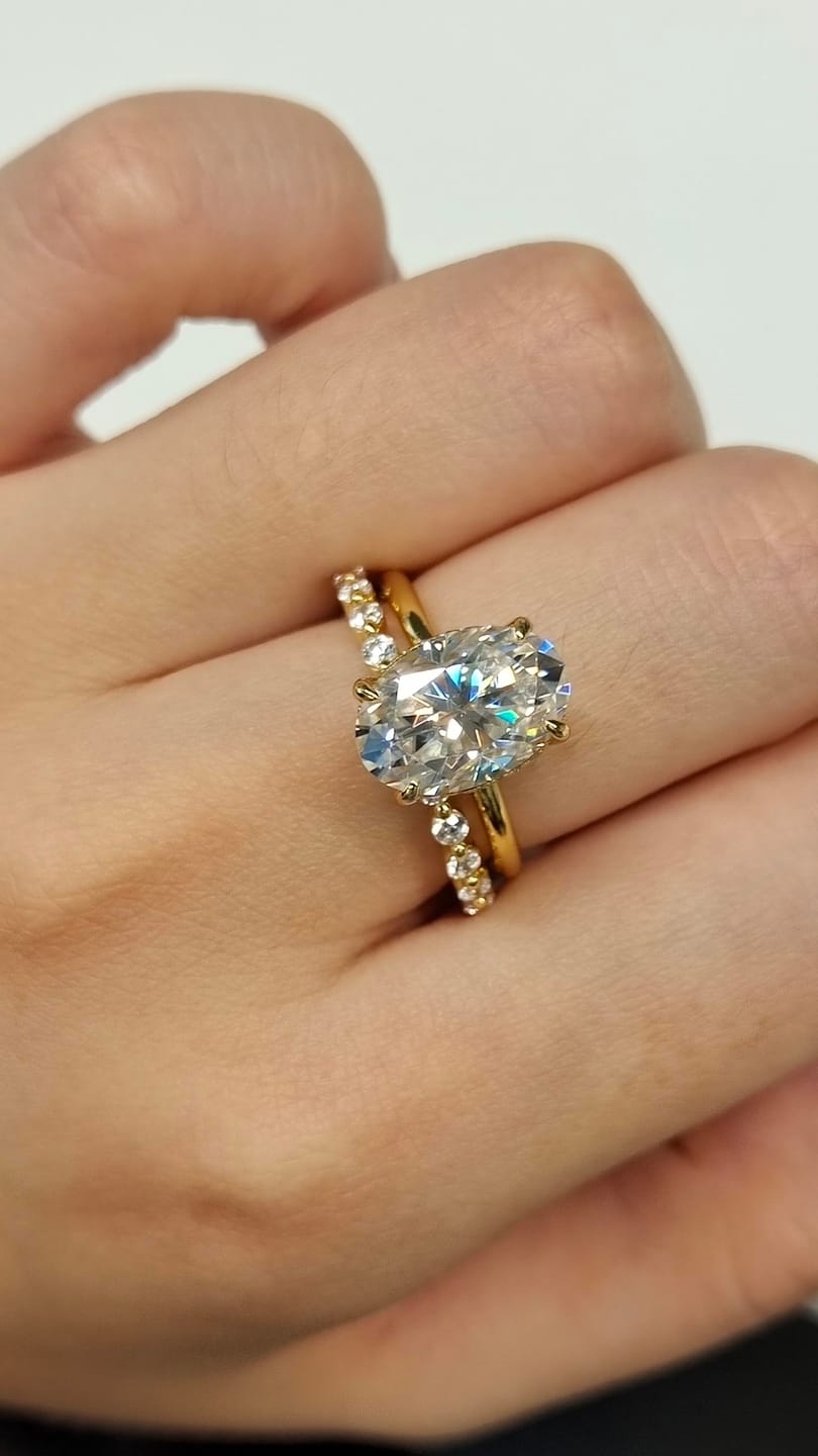Customer photo review of Moissanite 4.0Ct Hidden Halo Oval Cut Yellow Gold Engagement Ring with 1.5Ct Round Cut Wedding Band