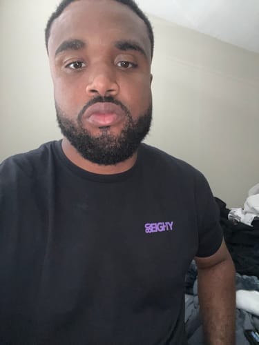 Customer takes a selfie wearing the black 80Eighty Limited Edition DCG88 Shirt.