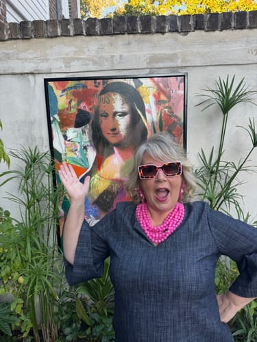 Customer with a fun expression models the vibrant, color-block Deco Sunglasses outdoors.