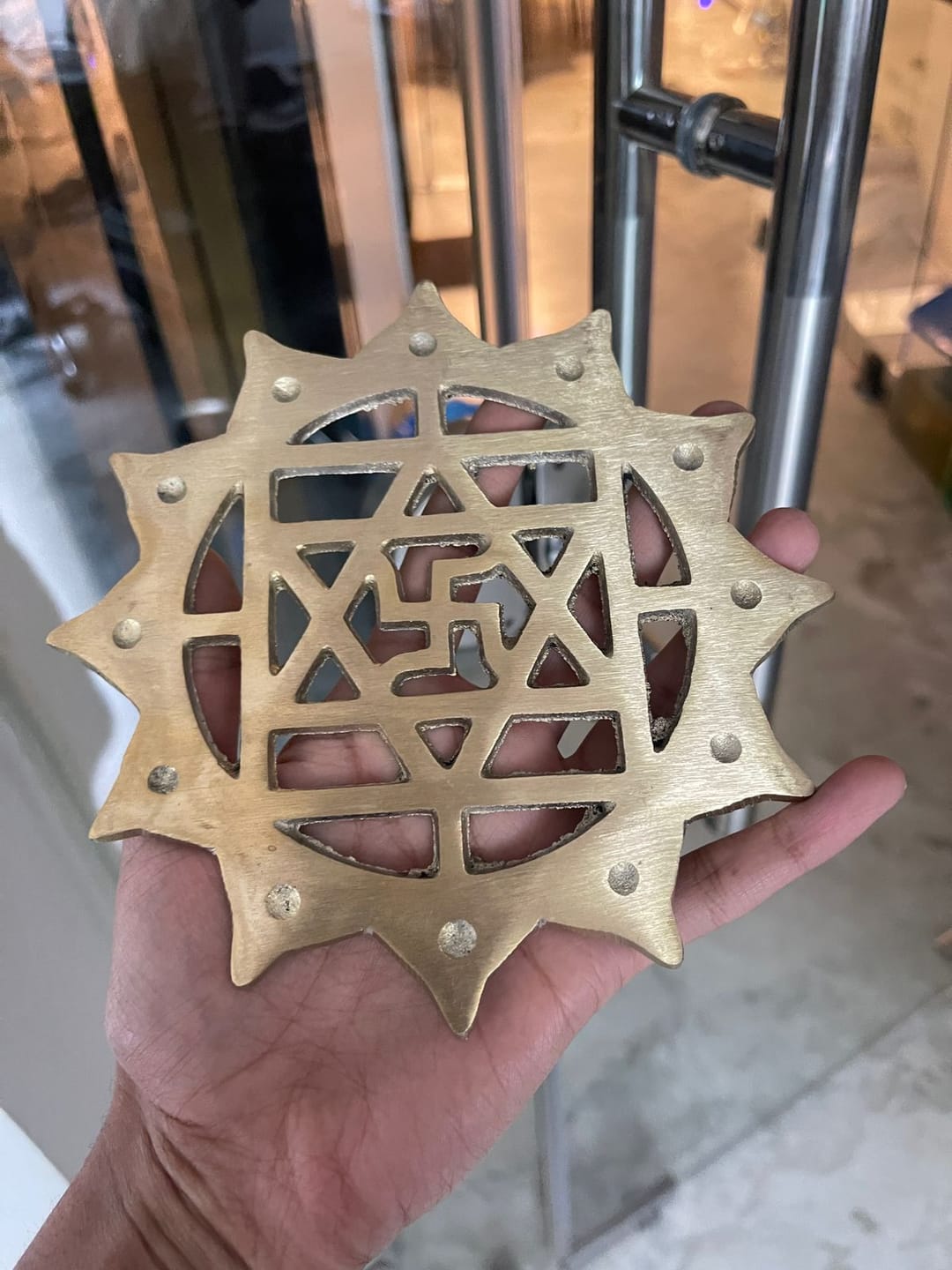 Customer photo review of Brass Swastik with Lotus Helix (Kamal Satya) – Vastu Remedy for Main Door Protection | Evil Eye & Positive Energy Shield | Kitchen/Entrance Placement | 6 x 6 Inch