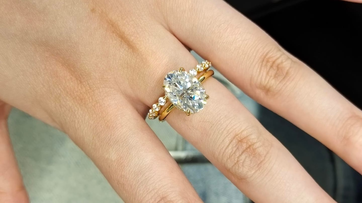 Customer photo review of Moissanite 4.0Ct Hidden Halo Oval Cut Yellow Gold Engagement Ring with 1.5Ct Round Cut Wedding Band