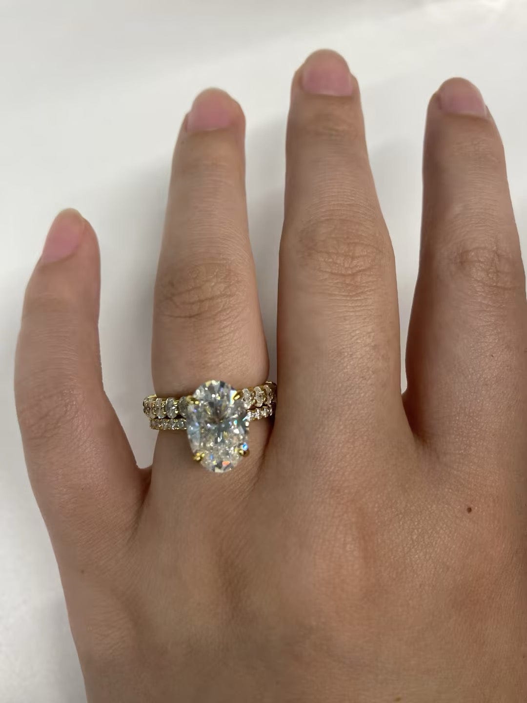 Customer photo review of Moissanite 4.0Ct Hidden Halo Oval Cut Yellow Gold Engagement Ring with 3.0Ct Oval Cut Wedding Band