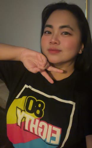 Reviewer wearing the black 80Eighty® Mystery Shirt with a colorful graphic.