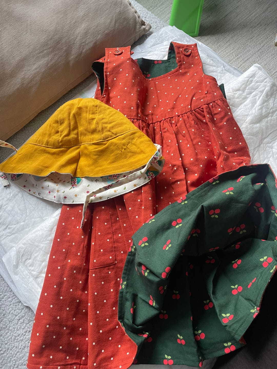 Customer photo review of Olive Cherries Reversible Pinny Dress