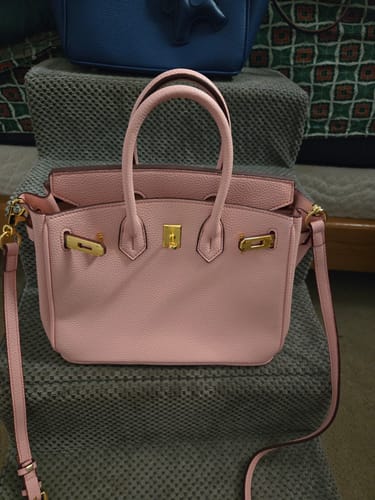Customer's pink pebbled leather Warkin Bag with gold hardware, shown from the front.