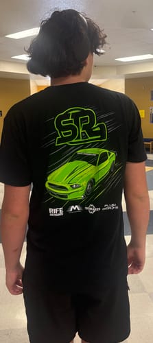 Customer from behind wearing the black Snot Rocket 3.0 Shirt, showing the large, green Mustang graphic on the back.