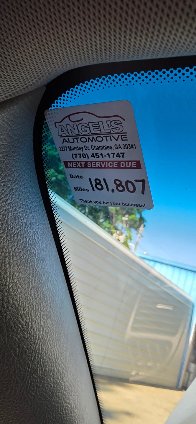Customer photo review of Custom Oil Change Stickers for Windshield with Logo