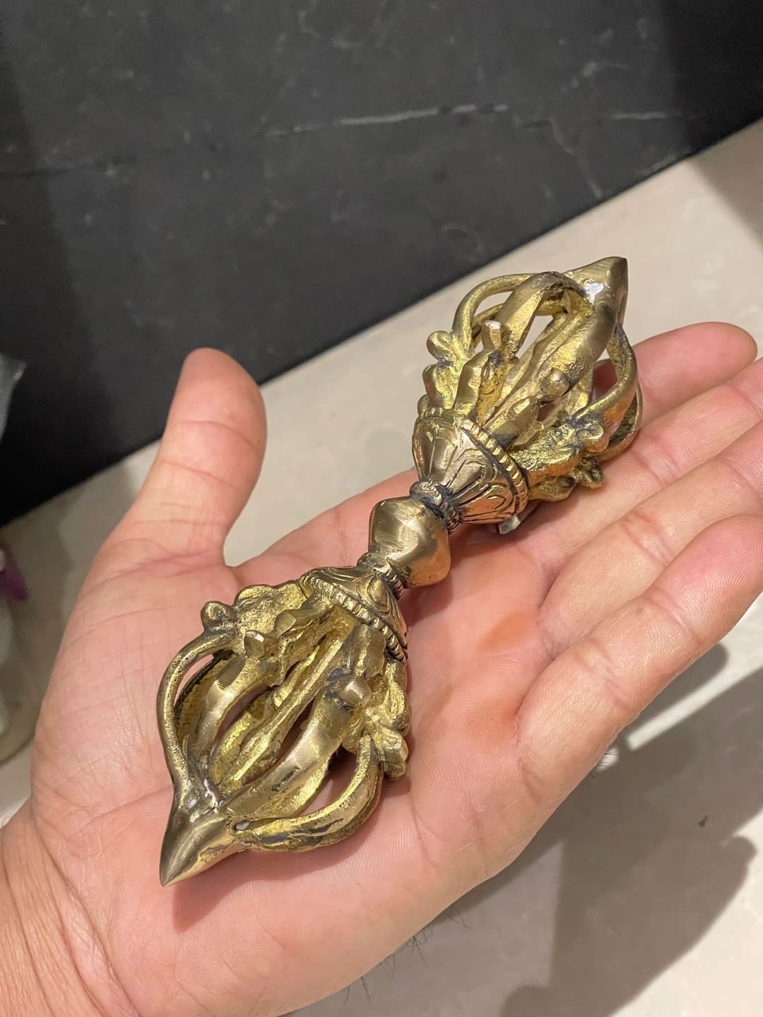 Customer photo review of Brass Vajra Dorje Ritual Tool Vastu Remedy for Protection, Tibetan Meditation and Home Temple Energy 15.7 x 4 cm | 340 gm