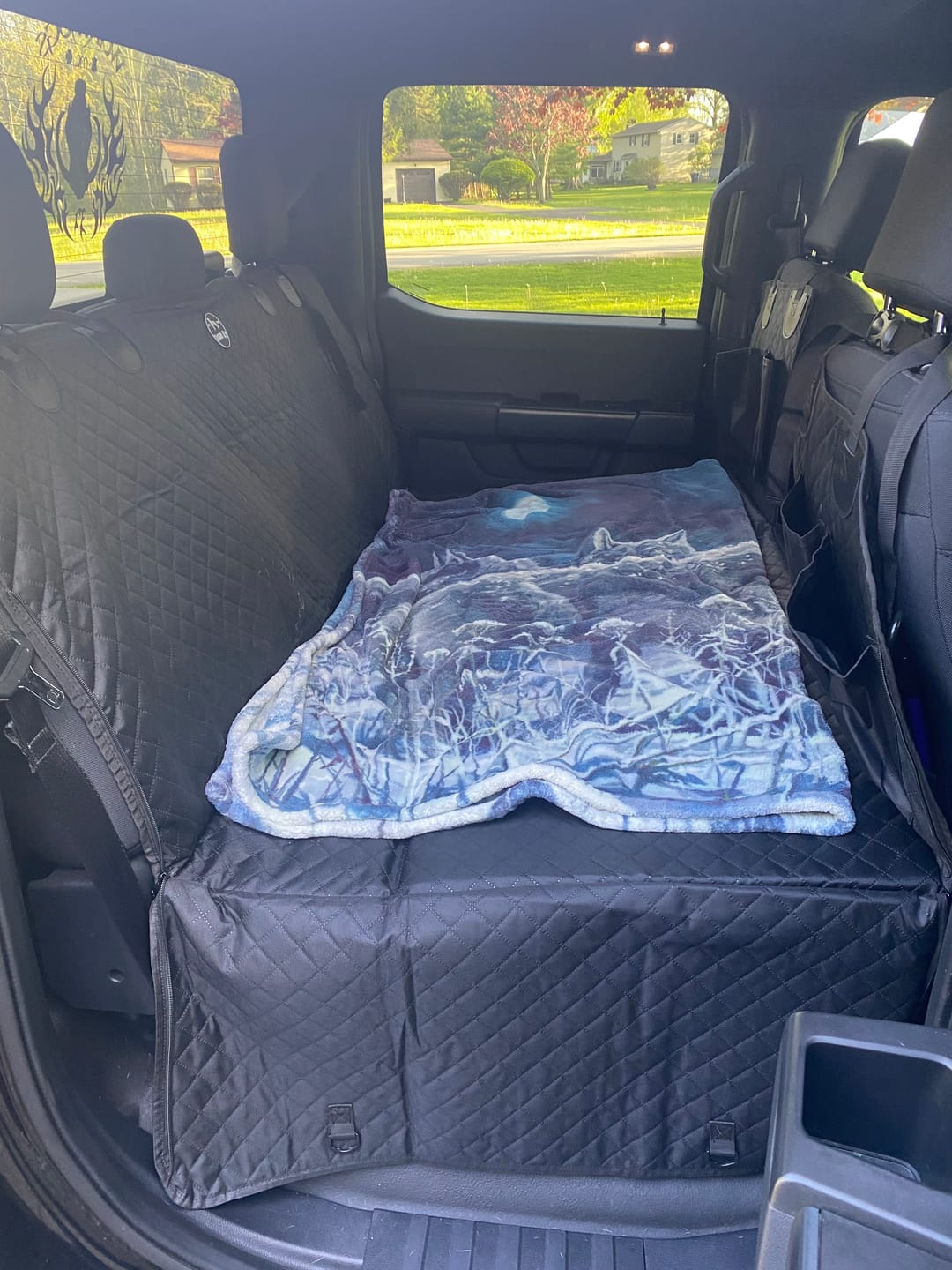 Customer photo review of NEW Waterproof Hard Bottom Car & Truck Seat Foldable Hammock Cover With Storage Pockets, Side Flaps, Headrest Straps, Seat Anchors, & Mesh Window (+FREE SAFETY BELT!)
