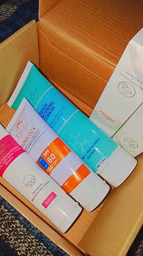 Customer's All Glow Pigmentation Bundle with the facewash, sunblock, and pigmentation cream tubes in the box.