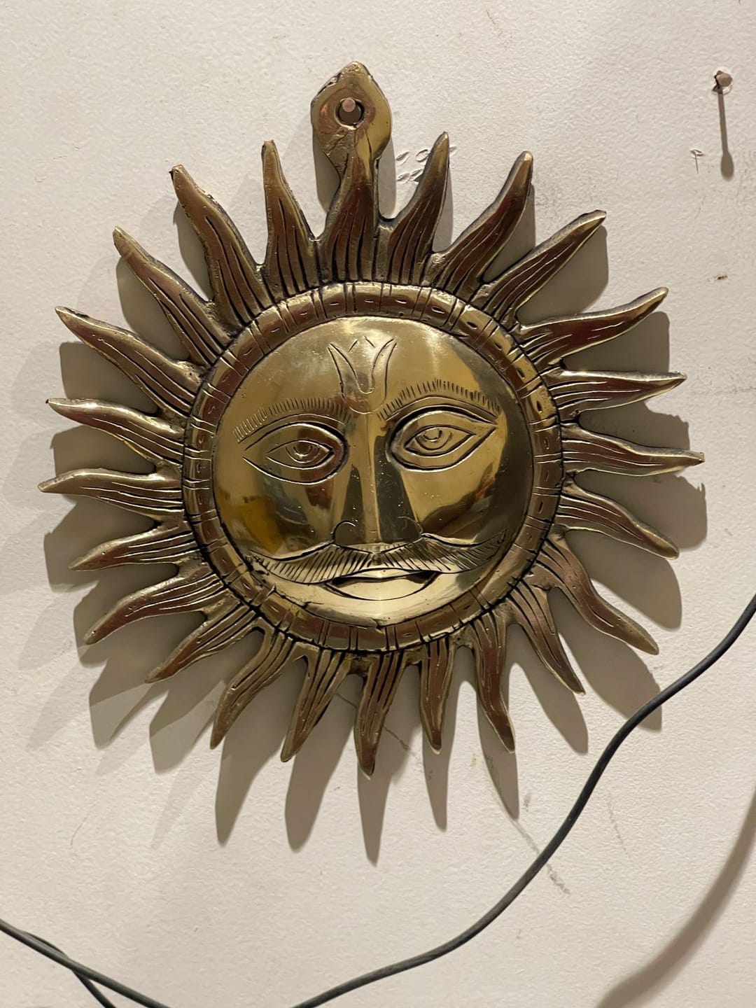 Customer photo review of Brass Surya (Sun) Ji Wall Hanging Idol Vastu Remedy for East Direction Balance, Fame and Positive Energy | 24 X 24 cm | 1 kg